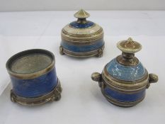 Three studio pottery pieces by Eleanor Newell, three lidded pots in blue and cream (one lid missing)
