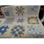 Modern patchwork quilt showing the various American quilt patterns, and modern patchwork hanging