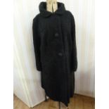 Persian lamb black vintage coat with three satin buttons, the green lining embroidered Debenham &