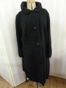 Persian lamb black vintage coat with three satin buttons, the green lining embroidered Debenham &