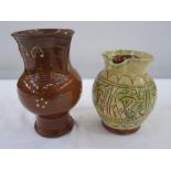 Studio pottery jug in yellow decorated with birds, 16.5cm high and another studio pottery jug,