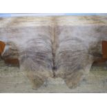 Large cow skin hide throw, mottled tan colour, 197cm x 190cm approx