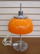 Harvey Guzzini mushroom-shaped table lamp with orange shade, chrome finial and base Condition