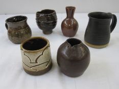 Winchcombe pottery brown glazed miniature vase, marked to base, two studio pottery tankards and