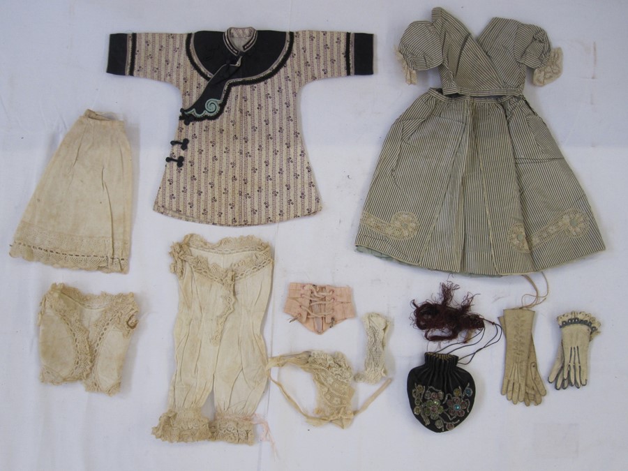 Victorian doll's clothes to include two pairs of gloves, a silk dress and top, undergarments, pair