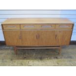 V B Wilkins G-Plan fresco sideboard, four drawers above cupboards on straight supports, 150cm wide