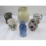 Quantity of studio pottery to include blue and red polka dot jug marked 'Goldsmiths' to base, studio