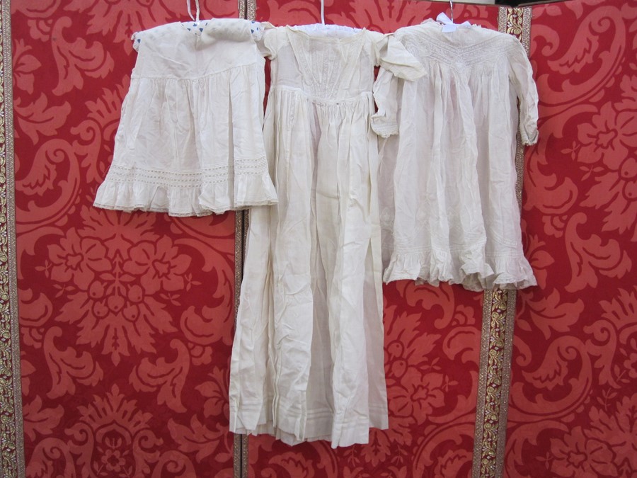 Two cotton and lace babygowns, a cotton sleeveless petticoat and a fine wool shawl marked 'Rob Roy'