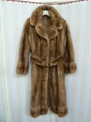 1970's full-length mink coat with banded hem, cuff sleeves, with belt and metal buckle