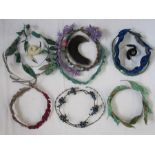 Collection of 1920's headdresses to include velvet decoration, sequins, faux-flowers, feathers,