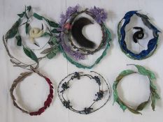 Collection of 1920's headdresses to include velvet decoration, sequins, faux-flowers, feathers,