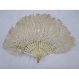 Small ostrich feather fan with bone sticks and guards, with gilt decorations