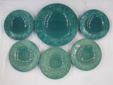 Set of five Ashtead turquoise pottery plates and matching charger with running deer to rim of plates