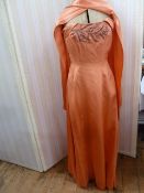 Phyllis Taylor apricot satin full length evening gown with embroidered bodice, with sash detail, a