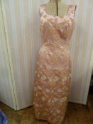 1960's pink brocade full length evening dress, and a blue chiffon with printed gold swags and