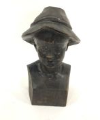 Stained and carved wood bust of a Tyrolean boy, on plinth base, 25cm high