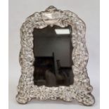 A late 20th century silver mounted photograph frame, bow and floral repousse decoration,