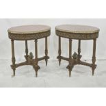 Pair of walnut occasional tables of oval form, the tops with parquetry star design, with gilt