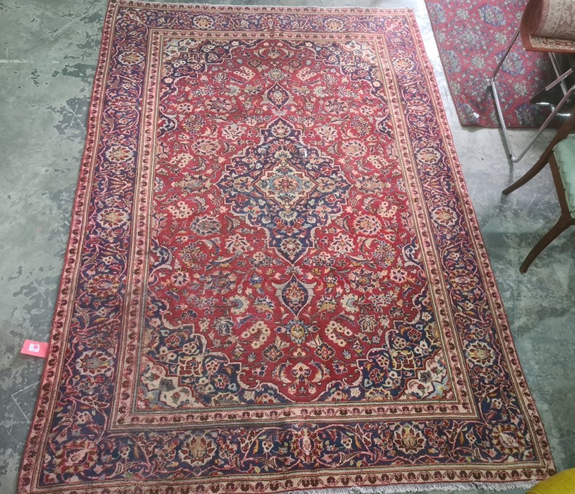 Village red ground Persian Kashan, traditional medallion design rug, 285 x 195cm