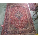 Village red ground Persian Kashan, traditional medallion design rug, 285 x 195cm
