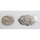 Chinese silver-coloured metal dragon embossed belt buckle, oval and pierced, 5cm wide, stamped