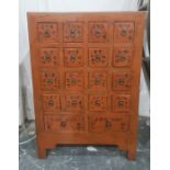 Chinese painted wooden cabinet fitted with sixteen small square drawers and two rectangular