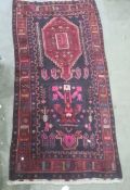 Rich ground heavily piled Iranian village rug, 296 x 152cm