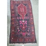 Rich ground heavily piled Iranian village rug, 296 x 152cm