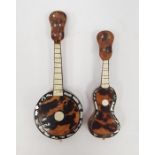 A miniature tortoiseshell and mother of pearl inlaid banjo and guitar (2)