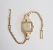 Lady's vintage 18K gold Rolex wristwatch having square face on gold-plated snake-pattern bracelet