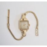 Lady's vintage 18K gold Rolex wristwatch having square face on gold-plated snake-pattern bracelet