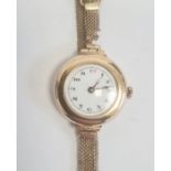 Vintage lady's 9ct gold wristwatch with enamel dial, on rolled gold mesh strap