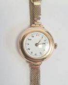 Vintage lady's 9ct gold wristwatch with enamel dial, on rolled gold mesh strap