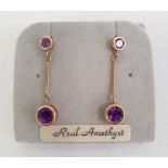 Pair 9ct gold and amethyst drop earrings, each set pair graduated stones  Condition