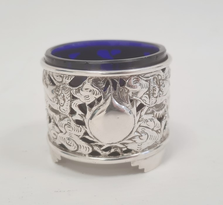 Chinese silver salt, cylindrical and pierced with dragons and flaming pearl, on three stepped