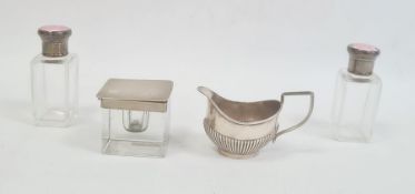 Glass inkwell of cube form with engine turned silver mounts and cover, pair of glass dressing