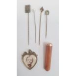 Gold (unmarked) and amber cheroot holder in case, gilt metal heart-shaped pendant and assorted hat