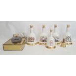 Assorted Bells shaped whisky bottles and a JM and F Martell Cordon Bleu bottle of cognac in