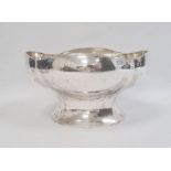 Large white metal bowl, probably Swedish, of shaped oval form, on flared pedestal foot, 29cm wide 26