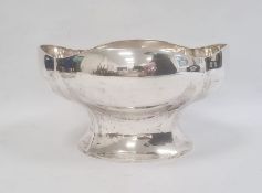 Large white metal bowl, probably Swedish, of shaped oval form, on flared pedestal foot, 29cm wide 26
