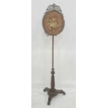 William IV rosewood polescreen with fretwork around the silk screen, triform base