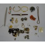 Quantity of costume jewellery to include clip-on earrings, gold-coloured bangles, rosary beads,