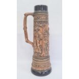 German Gerzit extra large pottery stein, embossed medieval figures and having blue glazed borders,