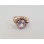 18ct gold and amethyst(?) circular set ring, the circular pale purple stone 8mm diameter, 2.4g total
