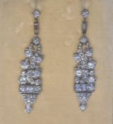 Pair of late 19th/early 20th century diamond set drop earrings, stylised leaf design, set with