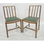 Pair of oak dining chairs with railbacks and curved cresting rail (2)