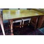 20th century oak rectangular dining table with cleated end supports, turned block legs to