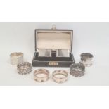 A pair of early 20th century silver napkin rings, scalloped edges, boxed, Birmingham 1929, makers