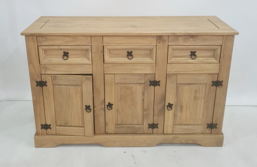 20th century pine sideboard, the rectangular top above three drawers, three cupboard doors, plinth