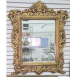 Rectangular bevel edge mirror in gilt-coloured moulded frame, of foliate design, 83cm x 65cm overall